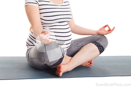 Image of Pregnant woman doing yoga asana asana padmasana with chin mudra