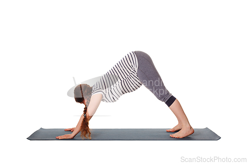 Image of Pregnant woman doing yoga asana Adho mukha svanasana