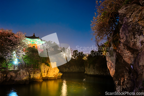 Image of Yongyeon Pond with Yongyeon Pavilion illuminated at night, Jeju islands, South Korea