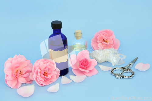 Image of Rose Flower Aromatherapy Essential Oil with Pink Roses 