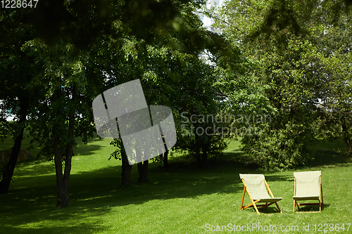 Image of Rest chairs in the garden. Resort concept