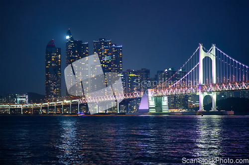 Image of Gwangan Bridge and skyscrapers in the night. Busan, South Korea