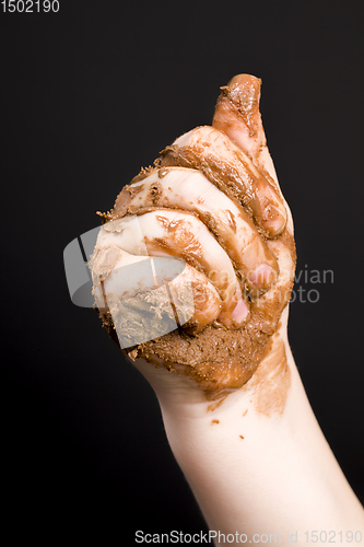 Image of smeared in chocolate hands