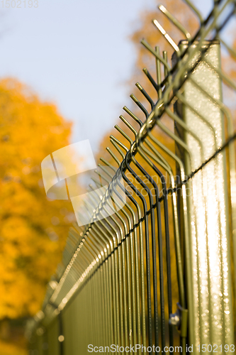 Image of metal fence installed in forest
