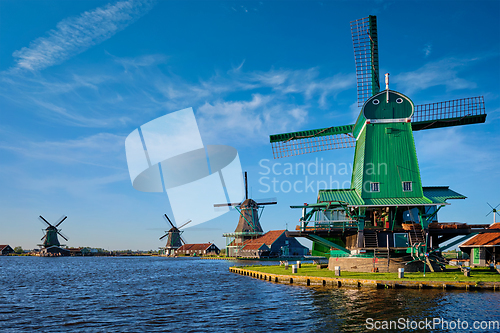 Image of Windmills at Zaanse Schans in Holland on sunset. Zaandam, Netherlands