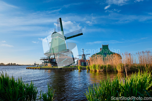 Image of Windmills at Zaanse Schans in Holland on sunset. Zaandam, Netherlands