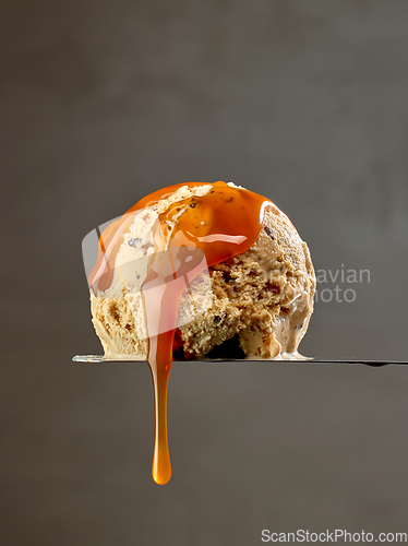 Image of ice cream scoop with caramel sauce