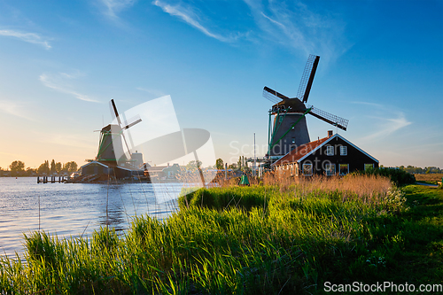 Image of Windmills at Zaanse Schans in Holland on sunset. Zaandam, Netherlands