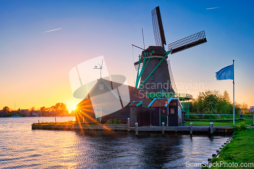 Image of Windmills at Zaanse Schans in Holland on sunset. Zaandam, Netherlands