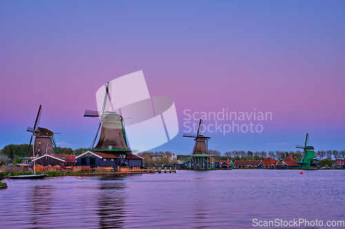 Image of Windmills at Zaanse Schans in Holland in twilight on sunset. Zaa