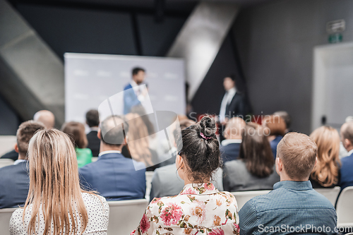 Image of Pitch presentation and project discussion at business convention or team meeting. Audience at the conference hall. Business and entrepreneurship symposium.