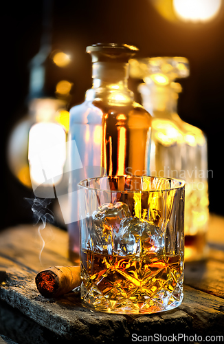 Image of Edison lamp and whiskey