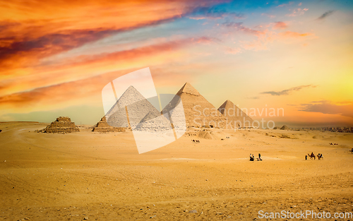 Image of Egyptian pyramid in sand desert