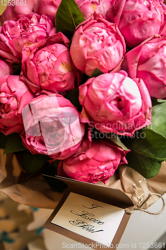 Image of Bouquet of peony roses with letter and note saying - I love you.