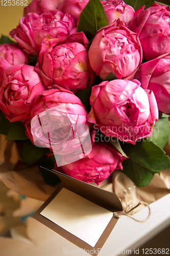 Image of Bouquet of peony roses with letter with space for text