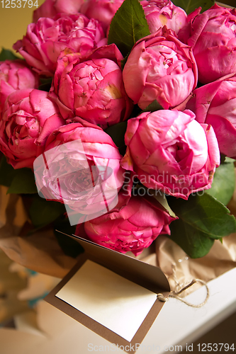 Image of Bouquet of peony roses with letter with space for text