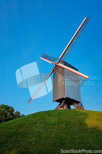 Image of Sint-Janshuismolen Sint-Janshuis Mill windmill in Bruges on sunset, Belgium