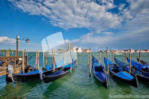 Image of Gondolas and in lagoon of Venice by San Marco square. Venice, Italy