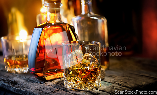 Image of Glass and bottle of whiskey