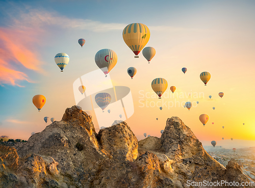 Image of Hot air balloons over rocks