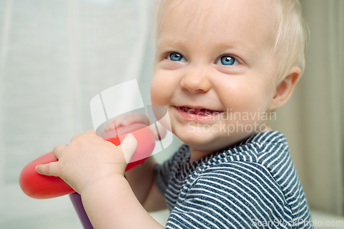 Image of Cute baby boy with toy - portrait