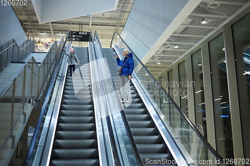 Image of Mother and child together on escalator background. Terminal, air
