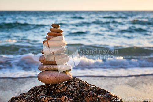 Image of Concept of balance and harmony - stone stack on the beach