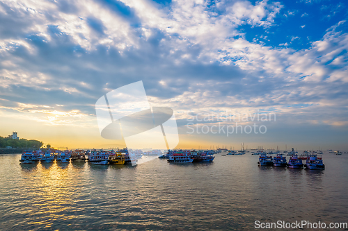 Image of Tourist boats in sea on sunrise in Mumbai, India