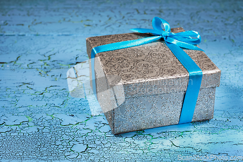 Image of Gift box with blue ribbon