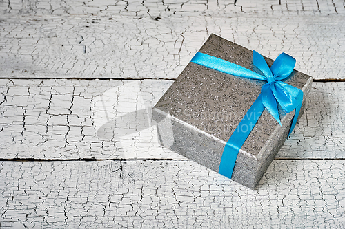 Image of Gift box with blue ribbon