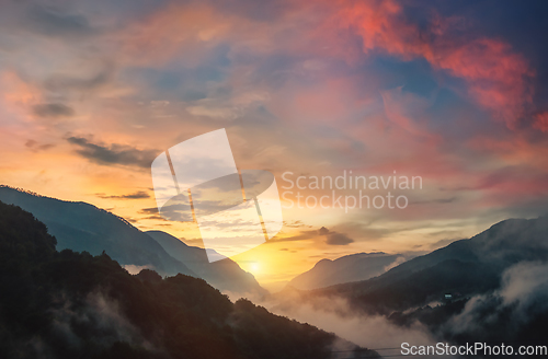 Image of Panorama mountains and of sunset