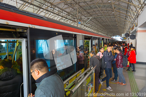 Image of People boarding train Shanghai Metro