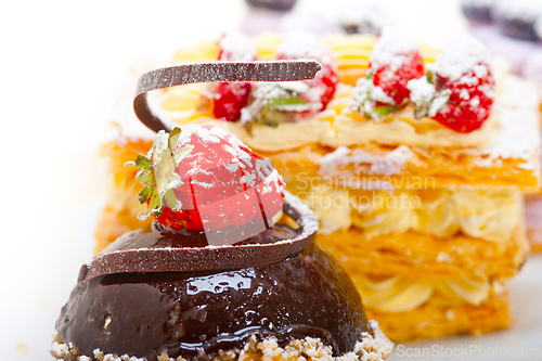 Image of selection of fresh cream cake dessert plate