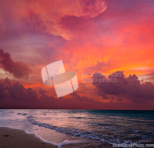 Image of Calm ocean and beach on tropical sunrise