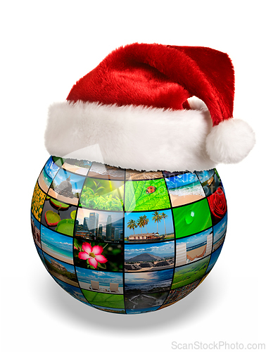 Image of Christmas concept - photo globe in Santa hat