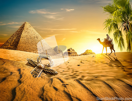 Image of Pyramids and ankh in desert