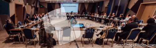 Image of Business meeting in a large, modern hall. A meeting of highly positioned personalities