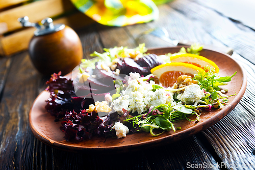 Image of Beet with goat cheese and nuts. Top view