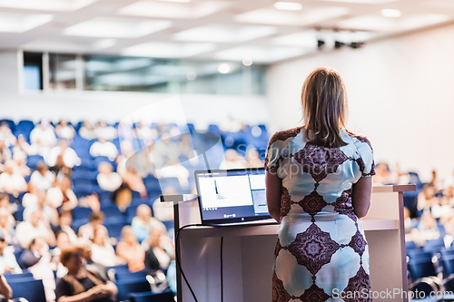 Image of Public speaker giving talk at Business Event.