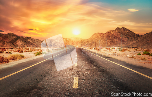 Image of Sun over road