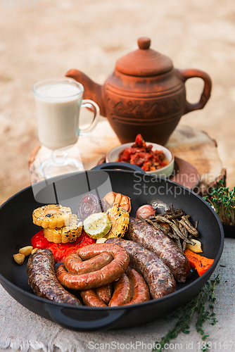 Image of Grilled sausages with vegetables