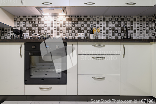 Image of Black and white modern kitchen interior closeup