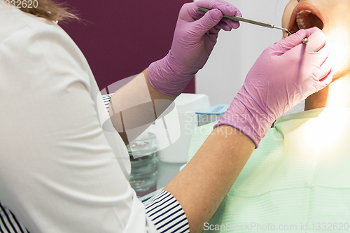 Image of Dentist working in dentist office