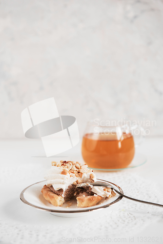 Image of Cakes with tea on white