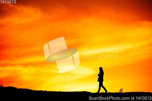 Image of Woman walking, silhouette