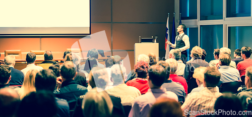 Image of Business speaker giving a talk at business conference meeting event.