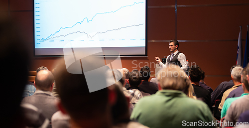 Image of Business speaker giving a talk at business conference meeting event.