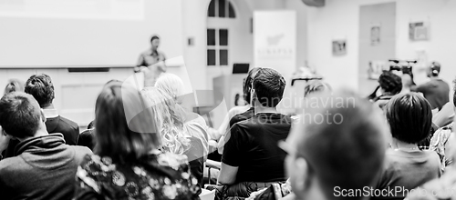 Image of Man giving presentation in lecture hall at university.