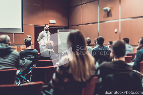 Image of Skiled Public Speaker Giving a Talk at Business Meeting.