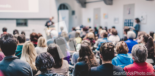 Image of Man giving presentation in lecture hall at university.